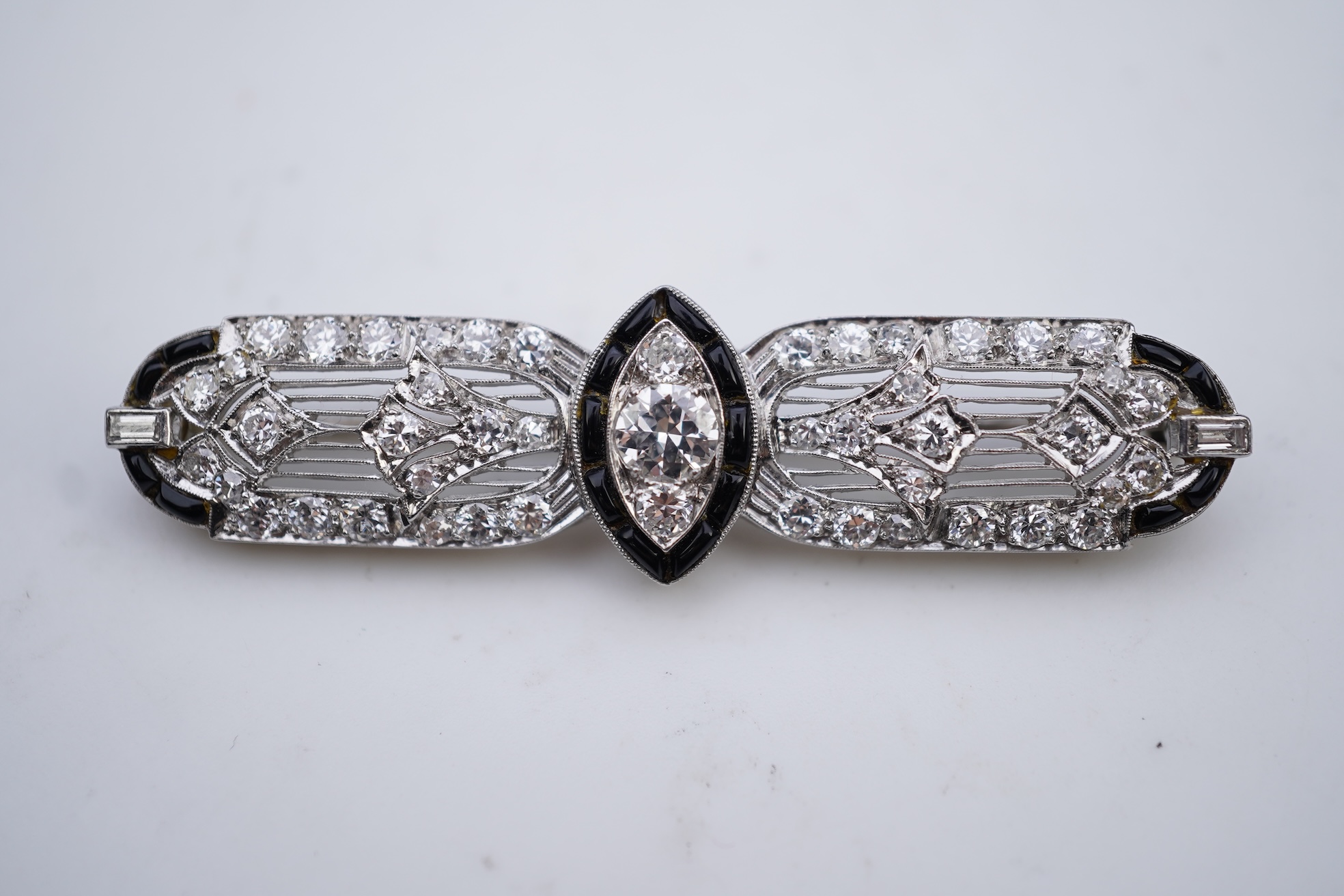 An Art Deco onyx and diamond brooch, 1920s